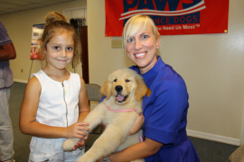 Addison Smith, Kristi Schmidt with Buttercup the puppy