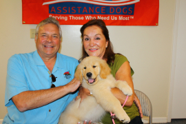 Joe Dinunzio, Nancy Dinunzio with Golden PAWS puppy