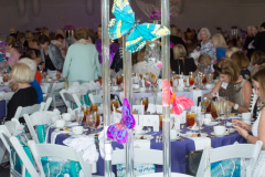 The whimsical Lucite centerpieces featured The Shelter’s familiar butterfly theme.