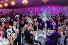 STAR Gala 2019 guest raise paddles during Bid for the STARs